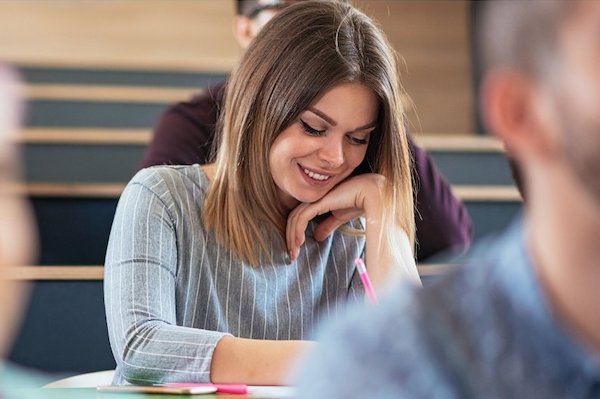 Female student in college classroom