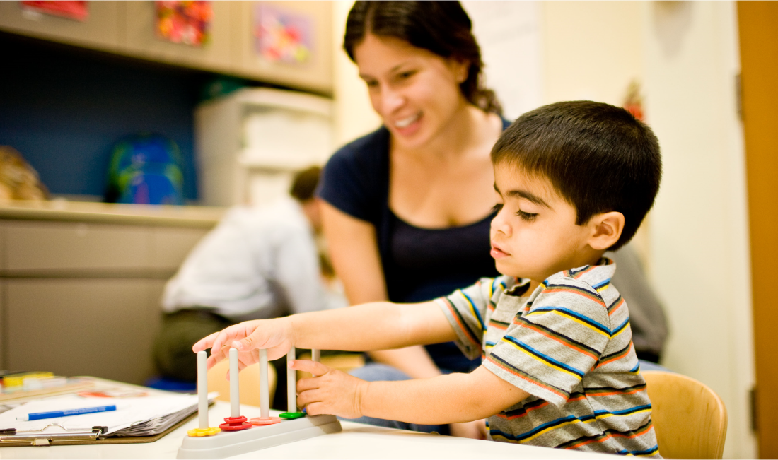 Teacher working with child in Human Services
