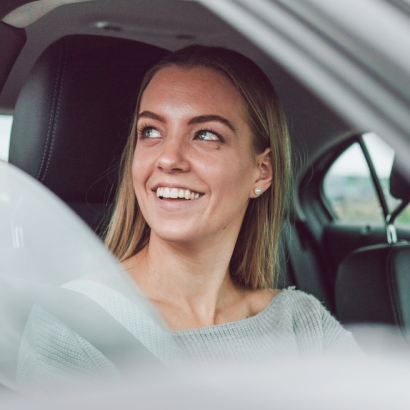 Driver's Ed student smiling in a car