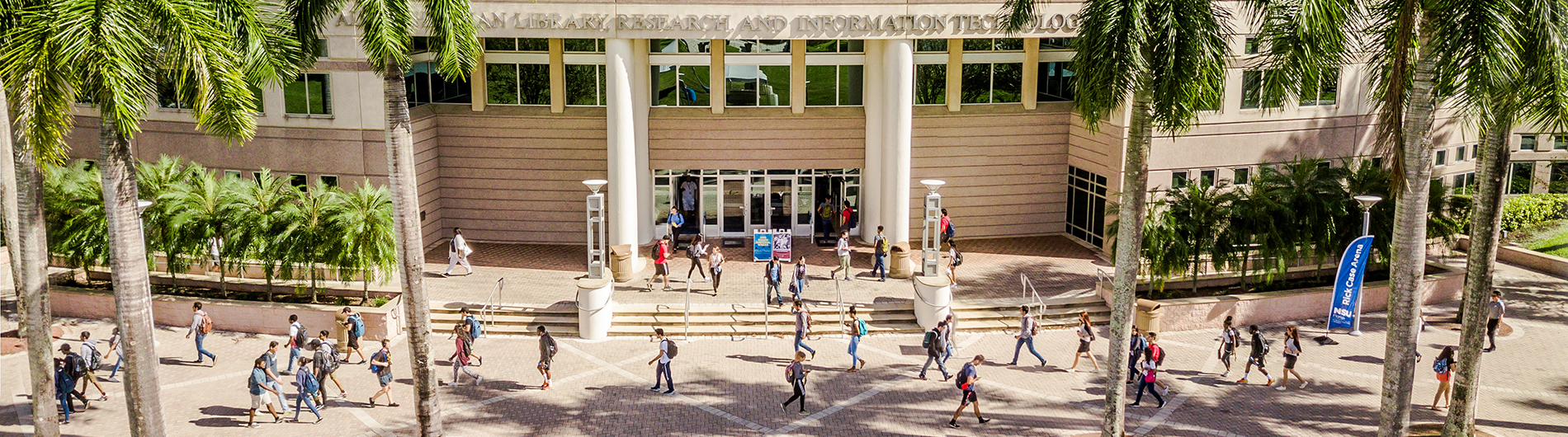 Front of NSU’s Alvin Sherman Library with students walking